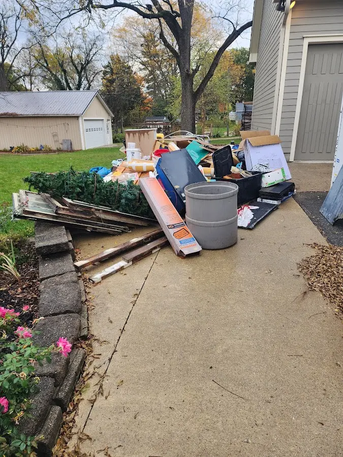 Dumpster being loaded with debris for Estate Cleanout Dumpster Rental in Wooster